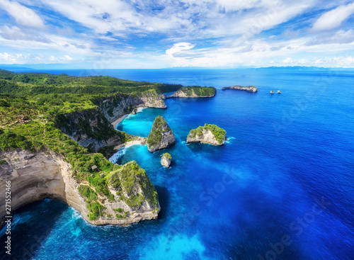 Fototapeta Naklejka Na Ścianę i Meble -  Panorama of aerial view at sea and rocks. Turquoise water background from top view. Summer seascape from air. Atuh beach, Nusa Penida, Bali, Indonesia. Travel - image