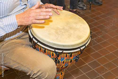 The percussionist uses the bongo to rhythm the song
