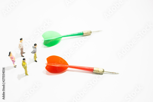a group of miniature business people with dart isolated white background. decision concept.