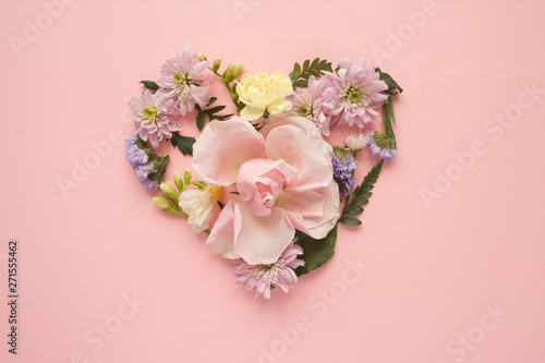 Heart made of flowers. Flat lay. Love concept.
