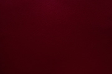 Burgundy red felt texture abstract art background. Solid color construction paper surface. Copy space.