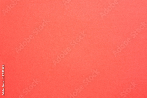 Coral red felt texture abstract art background. Solid color carton surface. Empty space. photo