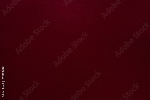 Burgundy red felt texture abstract art background. Solid color construction paper surface. Copy space. photo