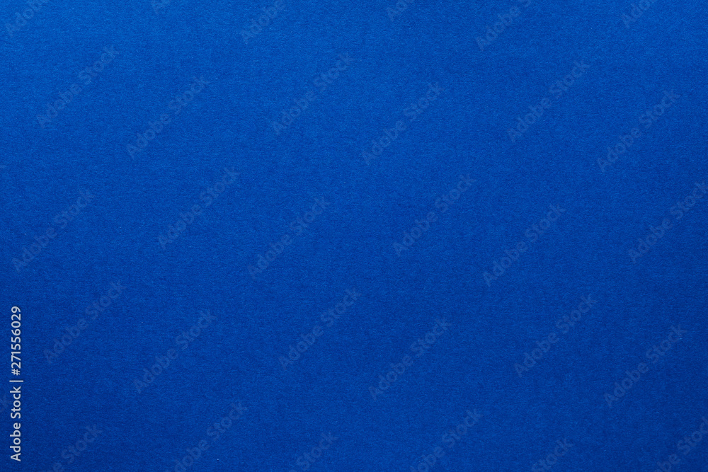 Blue felt texture abstract art background. Solid color wool textile surface. Copy space.