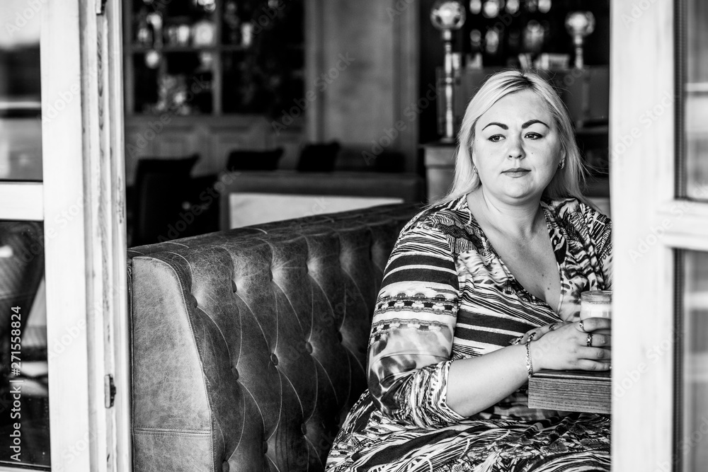 Simple plump woman at city. Lady in cafe rest and enjoy Simple plump woman at city. Lady in cafe rest and enjoy