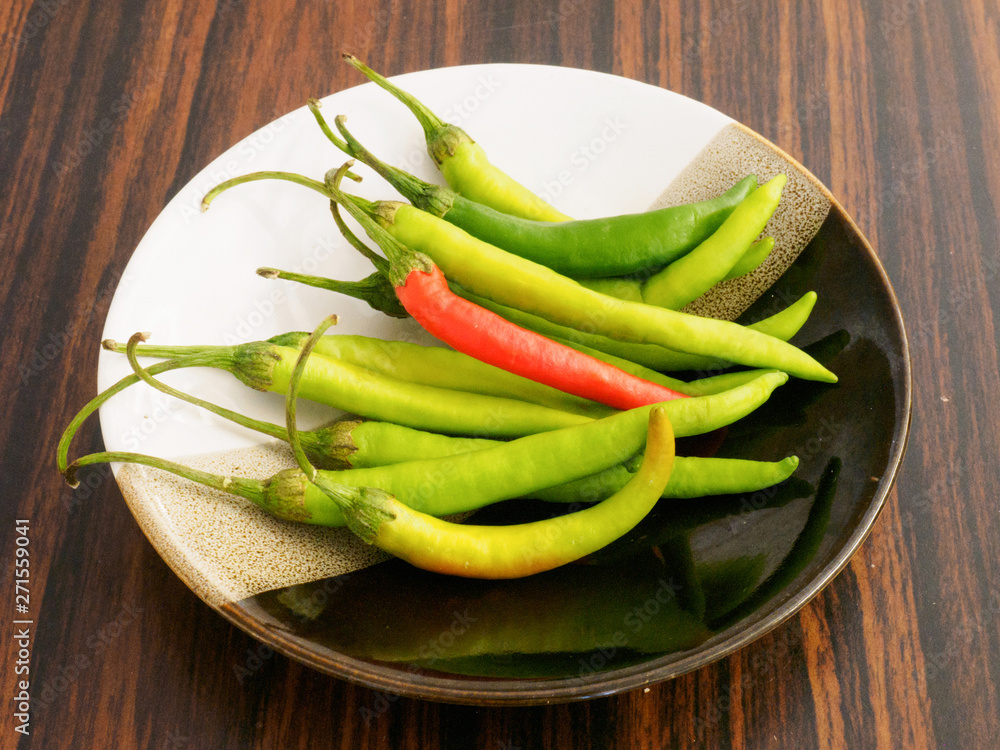 Chilli pepper in saucer in Kochi, Kerala, India Chilli pepper in saucer in Kochi, Kerala, India