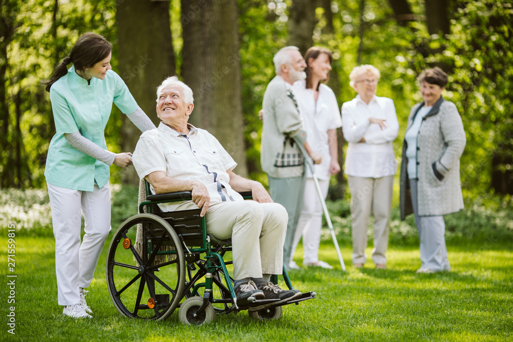 Group of patients and nurses in the nursing home Group of patients and nurses in the nursing home