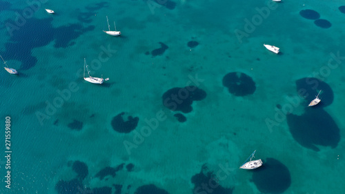 Aerial drone bird s eye top view photo of traditional fishing boats in island of Mykonos  Cyclades  Greece