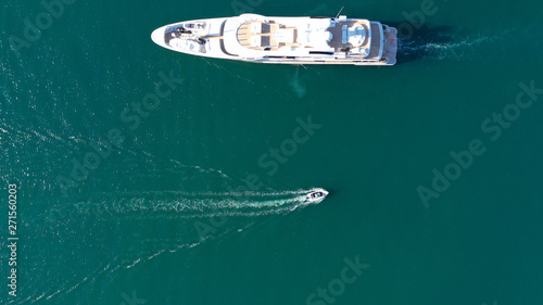 Aerial drone photo of luxury yacht docked in popular mediterranean destination port