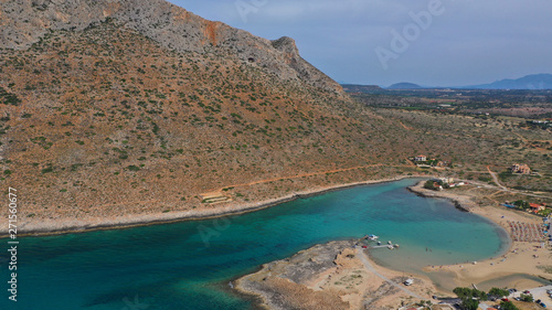 Aerial drone top view photo of turquoise organised beach forming a small heart shaped lagoon and mountainous seascape of Stavros, Chania, Crete island, Greece photo