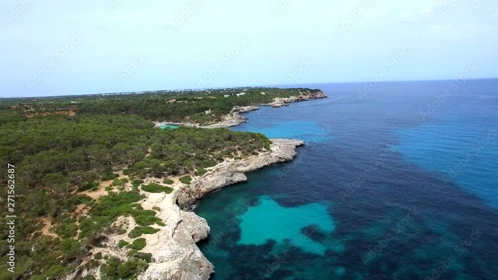 Drone shot flying over rocky coast line at Cala Mondrago National Park on Mallorca. Drone shot flying over rocky coast line at Cala Mondrago National Park on Mallorca.