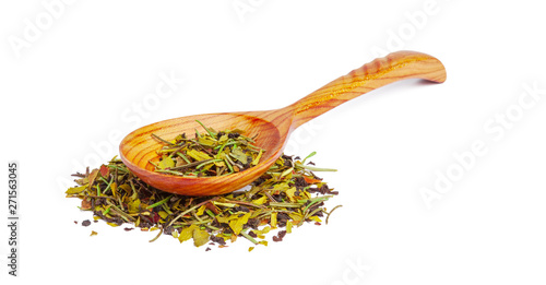 Dried tea on a wooden spoon, isolated on white