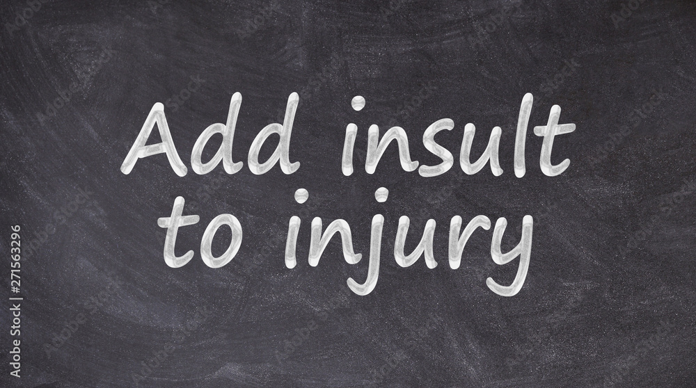 Obraz premium Add insult to injury written on blackboard