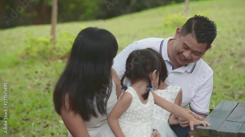 Happy Asian Family enjoying their time in the park