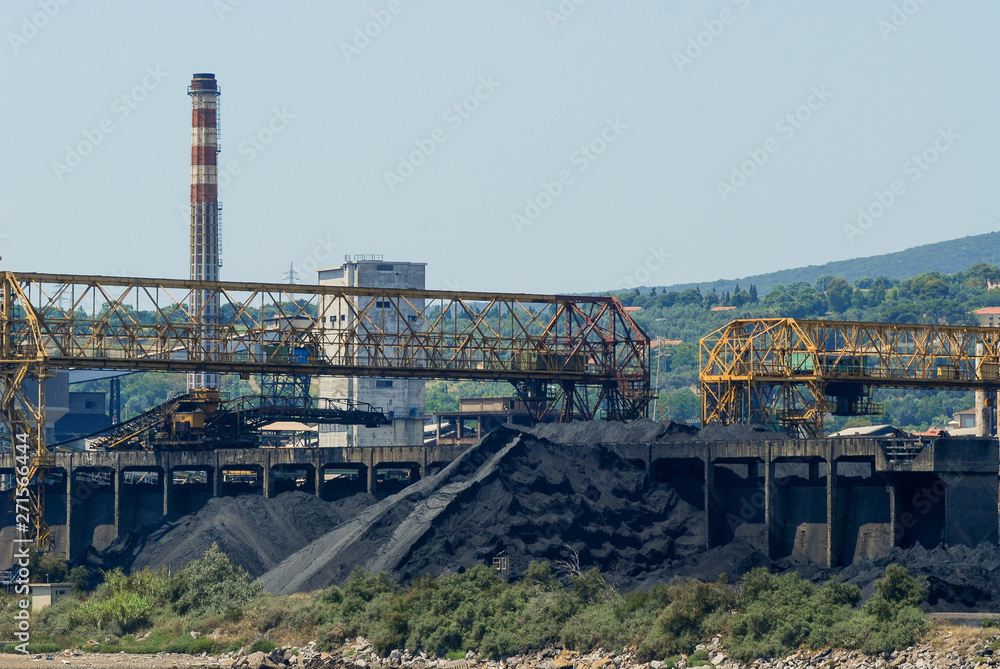 The port of Piombino with coal deposits and an industry that produces steel The port of Piombino with coal deposits and an industry that produces steel