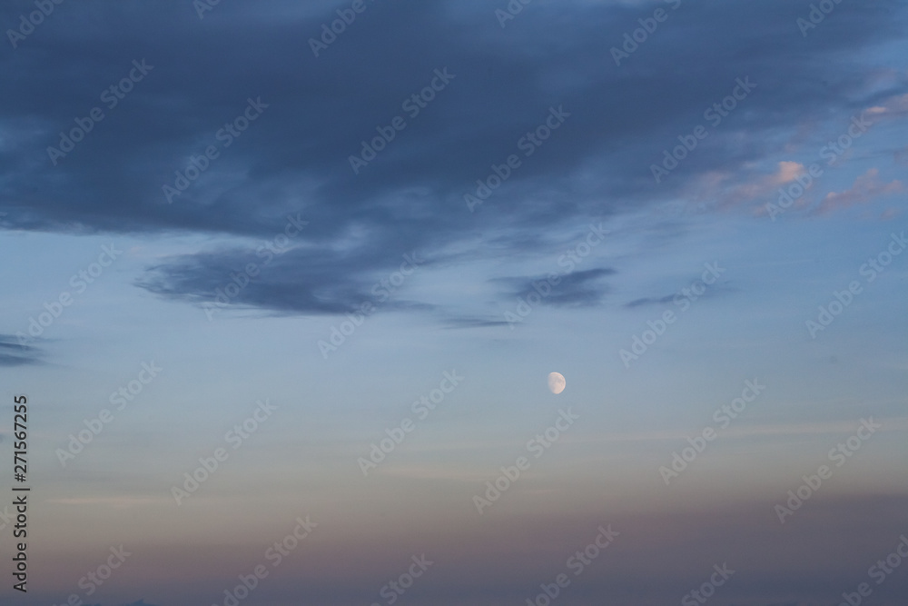 sunset in the sky with moon