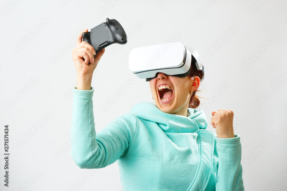 Woman with virtual reality headset is playing game. Woman with virtual reality headset is playing game.