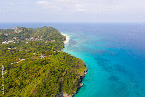 Boracay island, view from above. Rocky coast with rainforest.