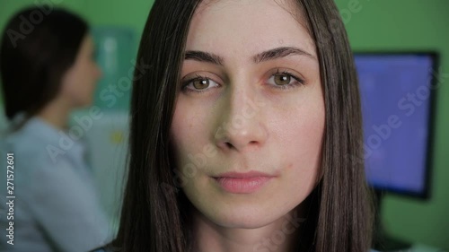 Wallpaper Mural Portrait Shot of a Beautiful Young Woman with glasses , serious girls on the Camera. In the Background Busy Office with Working Colleagues. 4k Torontodigital.ca