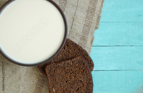 Bread slice, milk on wood table food background breakfast photo