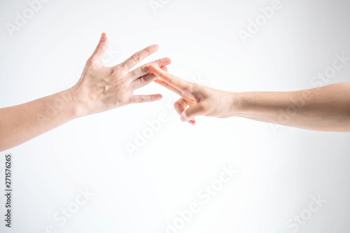 Wallpaper Mural Two person playing rock paper scissors; one hand showing paper symbol and another hand showing scissors symbol; concept of business competition. Torontodigital.ca