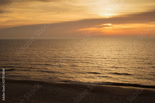 Beautiful sunset seascape with calm water. © Renar