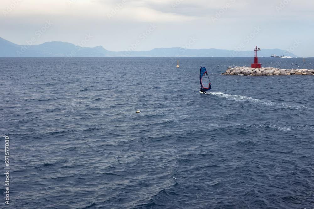 Obraz premium View of the bkue water of Gulf of Naples. The Gulf located along the south-western coast of Italy (Campania region). It opens to the west into the Mediterranean Sea.