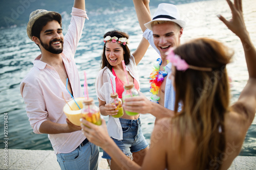 Carefree young friends enjoying summer party together