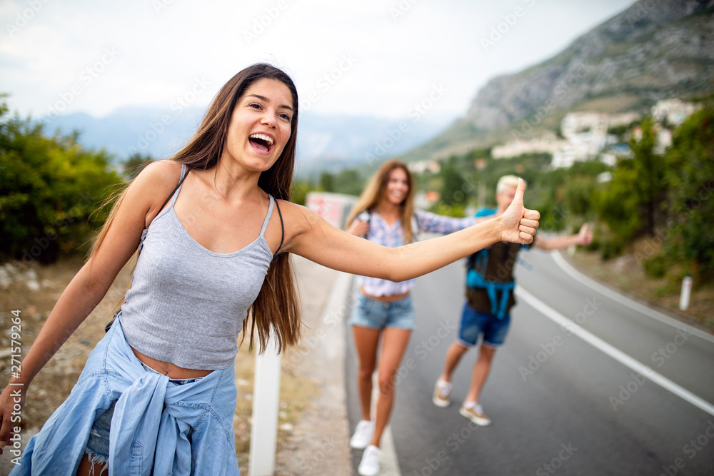 Group of happy friend traveler walking and having fun. Travel lifestyle and seasonal vacation concept Group of happy friend traveler walking and having fun. Travel lifestyle and seasonal vacation concept