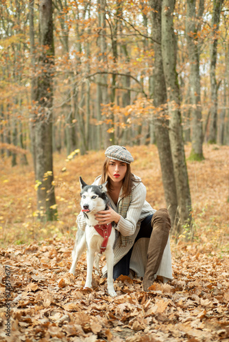 Girl pretty stylish woman walking with husky dog autumn forest. Pedigree dog concept. Best friends. Unconditional love. Girl enjoy walk with husky dog. Siberian husky favorite pet. Animal husbandry © Volodymyr