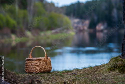 wowen wooden picnic basket in nature trails in summer photo