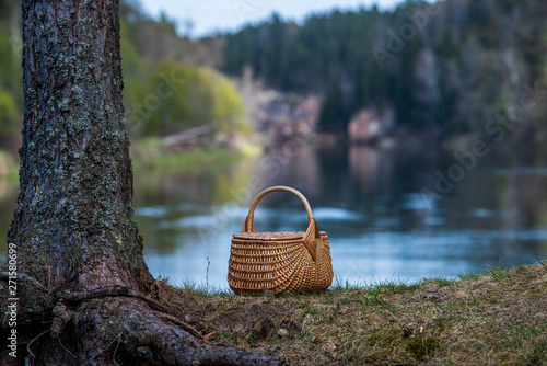 wowen wooden picnic basket in nature trails in summer photo