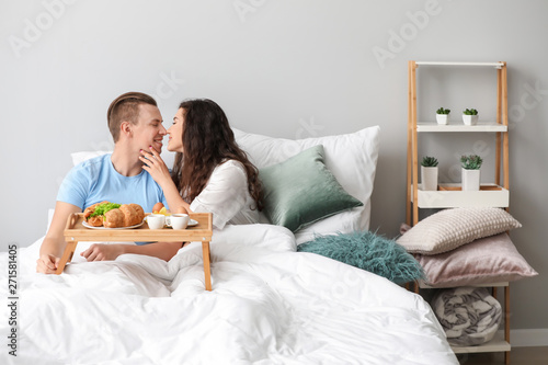 Cute young couple having br...