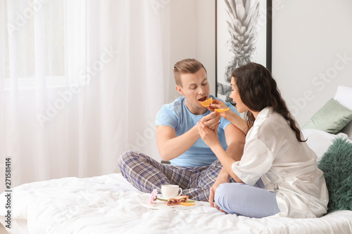 Cute young couple having br...