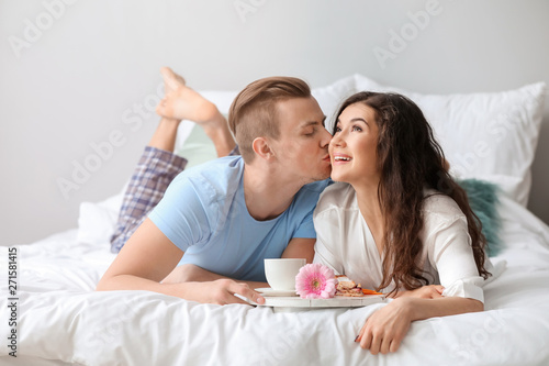 Cute young couple having br...