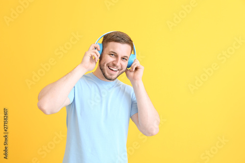 Handsome young man listenin...