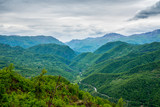 Montenegro, Endless view over green tree covered mountains forming moraca canyon nature landscape from above