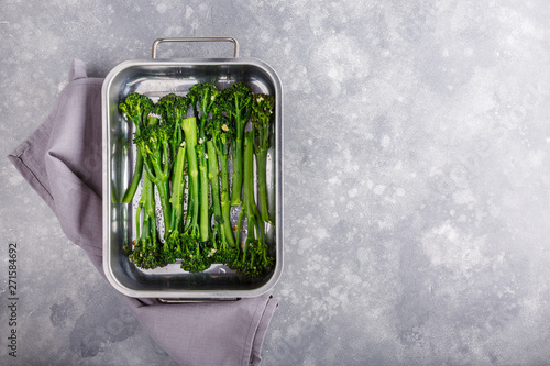 Grilled broccolini in baking dish.  Baked baby broccoli. Food background. Top view. Close-up. Copy space. photo