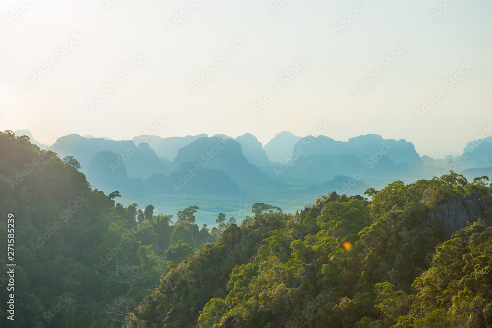 Beautiful tropical landscape with mountain rainforest and steep rocky ridge at horizon at sunset. Krabi, Thailand Beautiful tropical landscape with mountain rainforest and steep rocky ridge at horizon at sunset. Krabi, Thailand