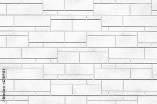Outdoor white stone tile wall texture and background
