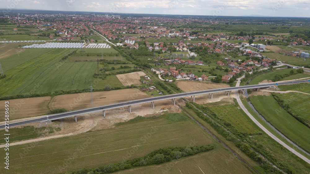 A new recently built highway in Brcko district, Bosnia and Herzegovina. The road was built by Spanish company Rubau and is important for the region A new recently built highway in Brcko district, Bosnia and Herzegovina. The road was built by Spanish company Rubau and is important for the region