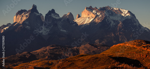 Panoramic shot of the snow and ice capped mountains - Cordillera Paine in Torres del Paine National Park in Chilean Patagonia during sunset
