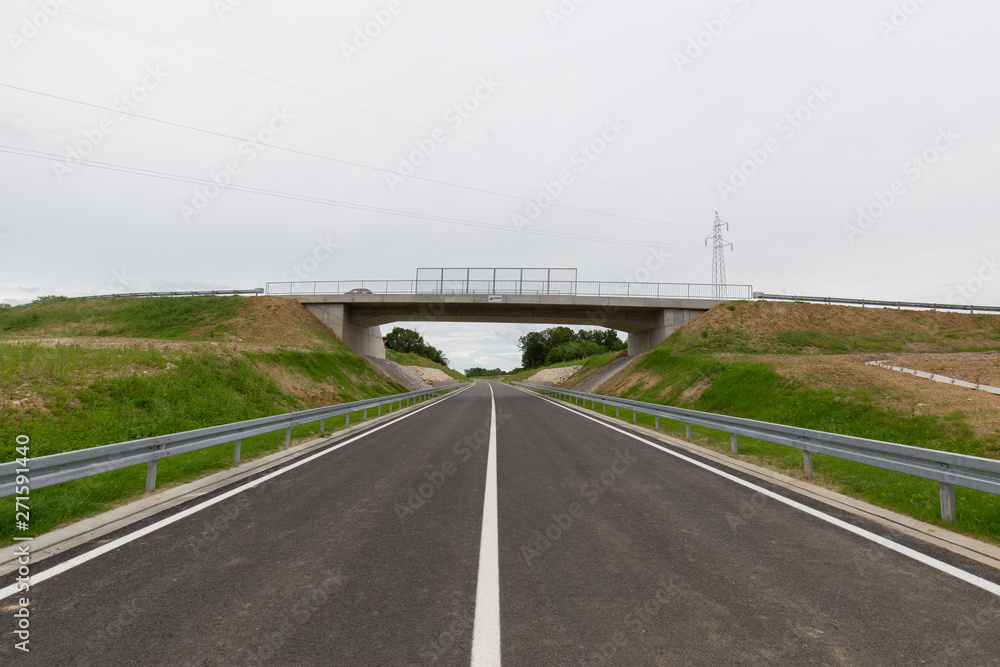 A new recently built highway in Brcko district, Bosnia and Herzegovina. The road was built by Spanish company Rubau and is important for the region A new recently built highway in Brcko district, Bosnia and Herzegovina. The road was built by Spanish company Rubau and is important for the region