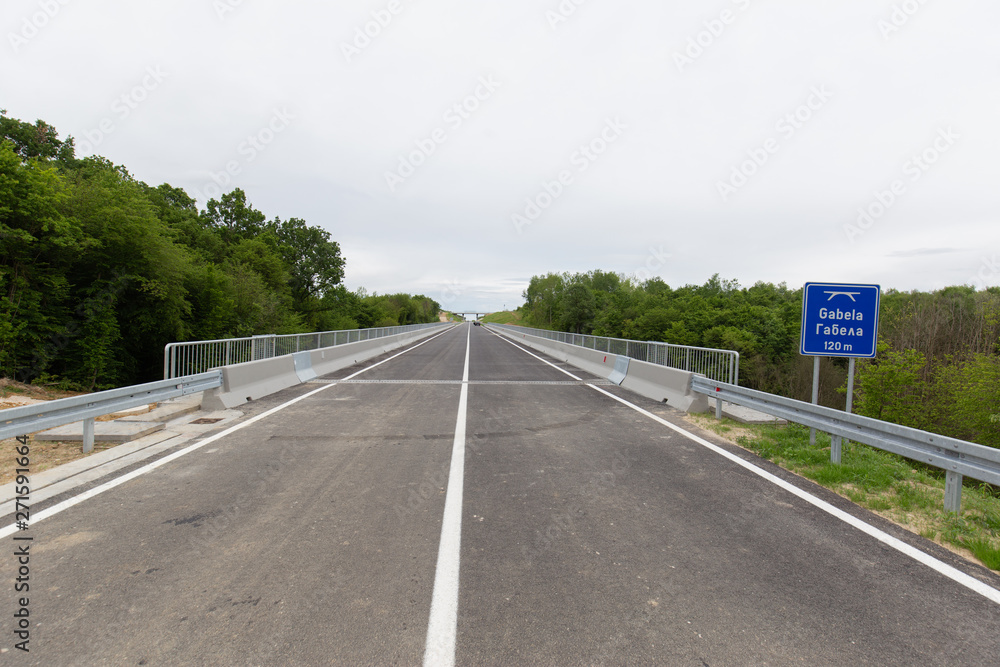 A new recently built highway in Brcko district, Bosnia and Herzegovina. The road was built by Spanish company Rubau and is important for the region A new recently built highway in Brcko district, Bosnia and Herzegovina. The road was built by Spanish company Rubau and is important for the region