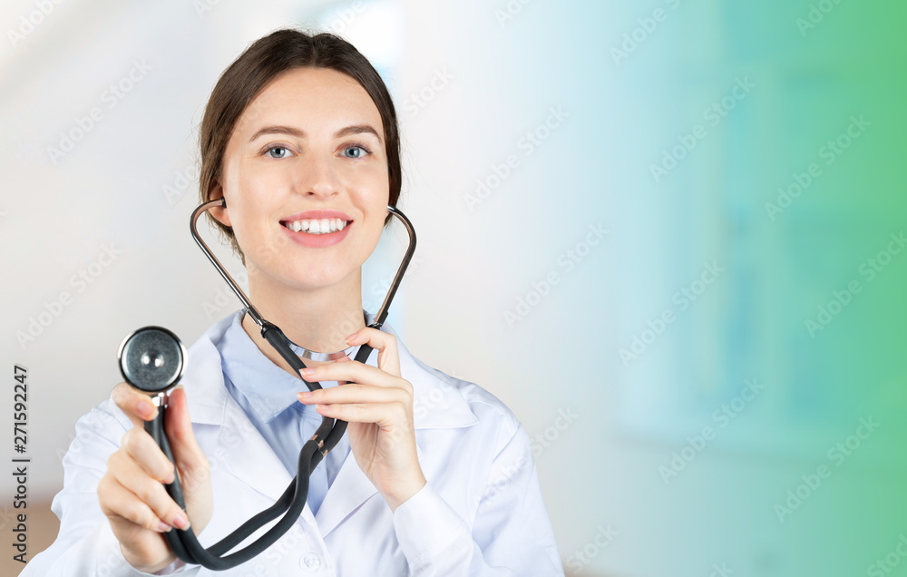 Portrait of an attractive young female doctor in white coat Portrait of an attractive young female doctor in white coat