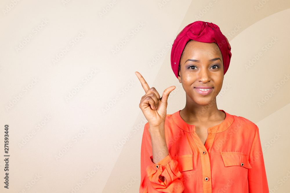 Close up portrait of a happy business woman pointing finger