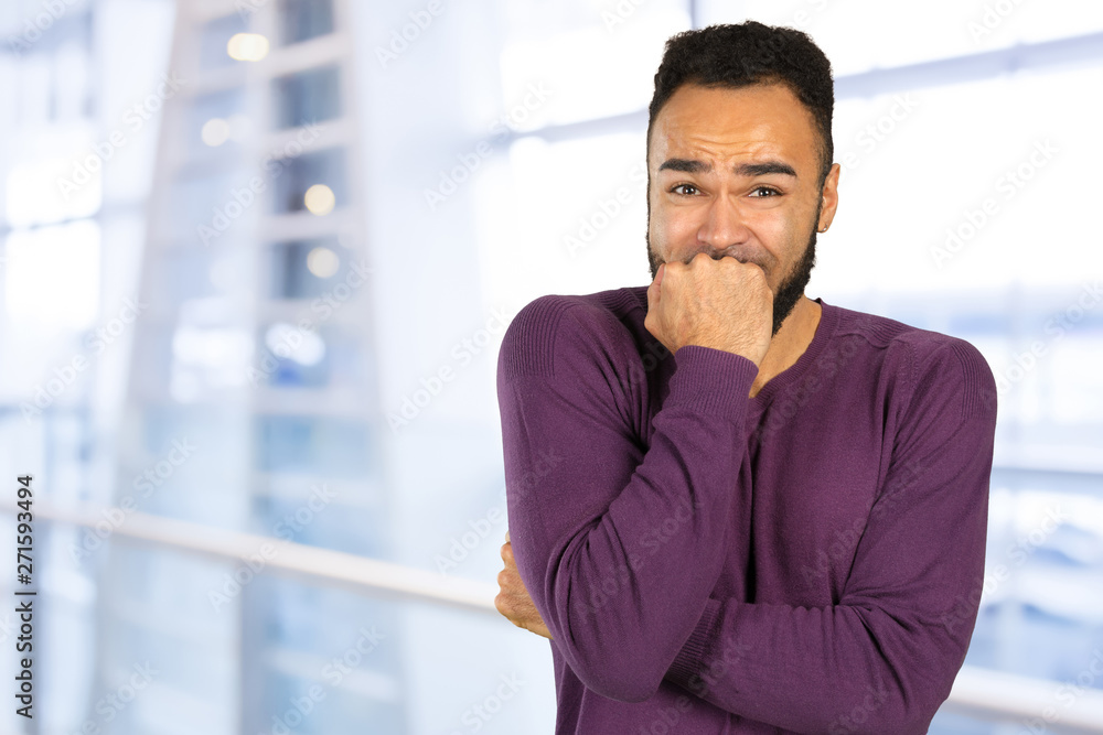 Black anxious stressed young man looking at camera Black anxious stressed young man looking at camera
