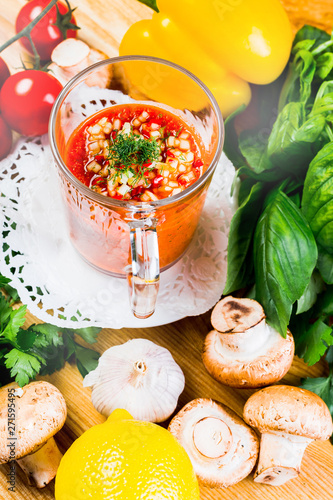 Tomato soup with fresh ingredients in a soup cup