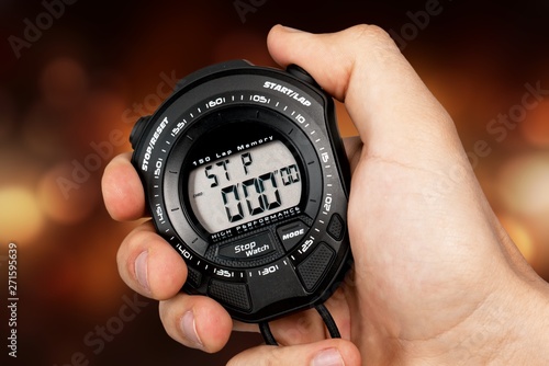 Man hand using black speedometer on bokeh background
