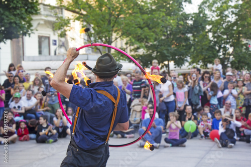 Street performer with a fire wheel photo